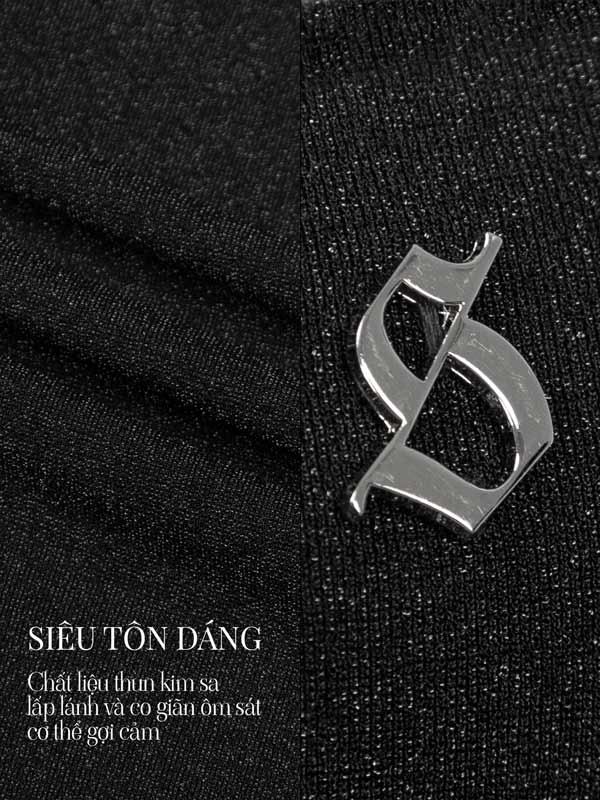 Metallic logo on black fabric with text in a foreign language