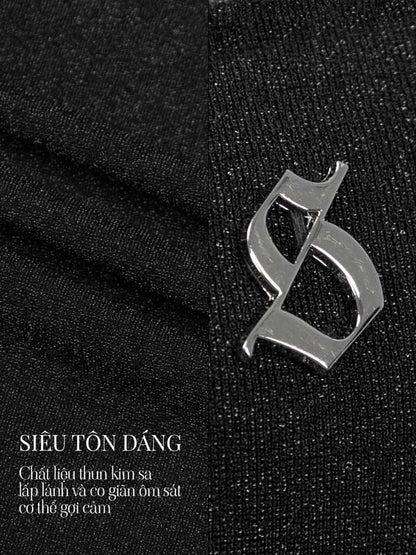 Metallic logo on black fabric with text in a foreign language