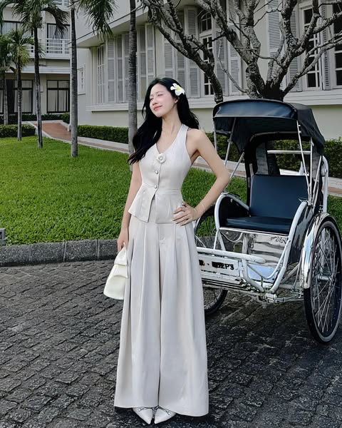 Close-up of camellia pin on Rosie Top