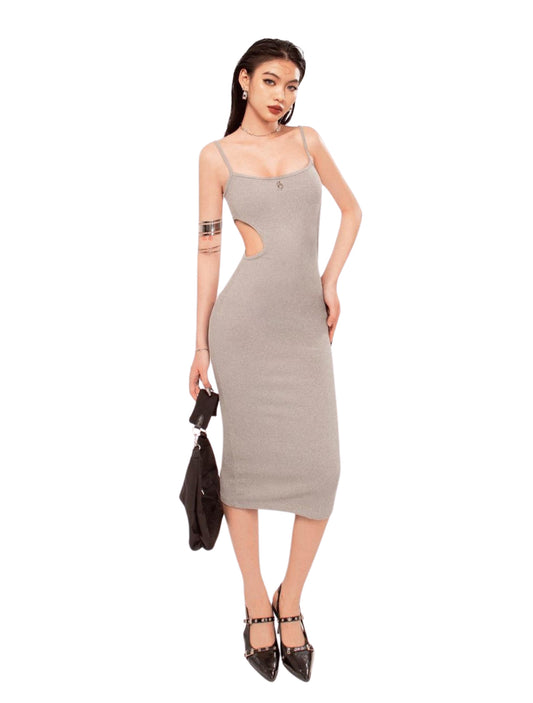 Woman wearing a gray dress with cut-out design on a white background