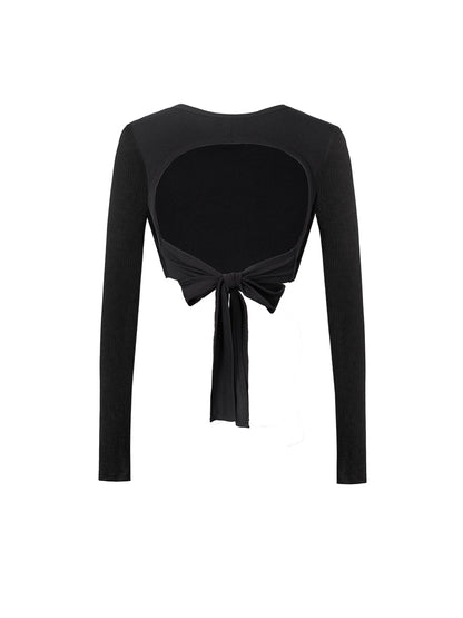 Black long-sleeve top with a tie detail on a white background