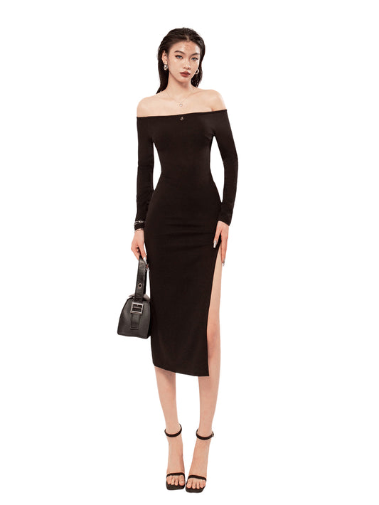 Woman wearing a black off-shoulder dress with a slit on a white background