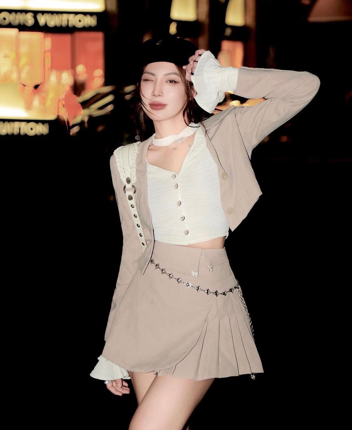 Woman in a stylish outfit with a blurred background