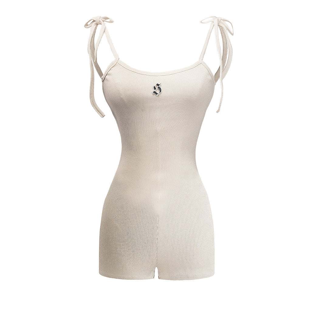 Beige ribbed bodysuit with thin straps on a white background