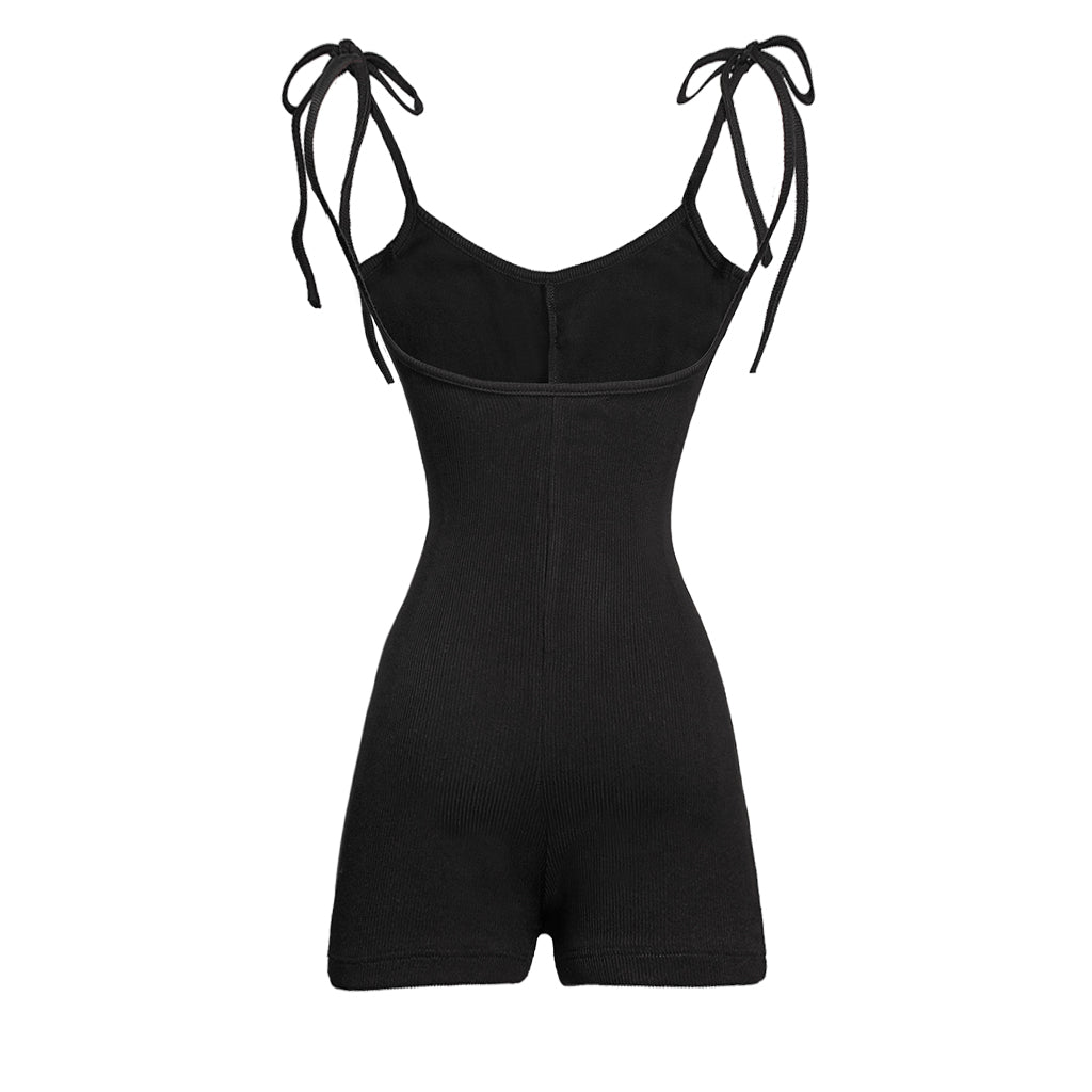 Black romper with tie straps on a white background