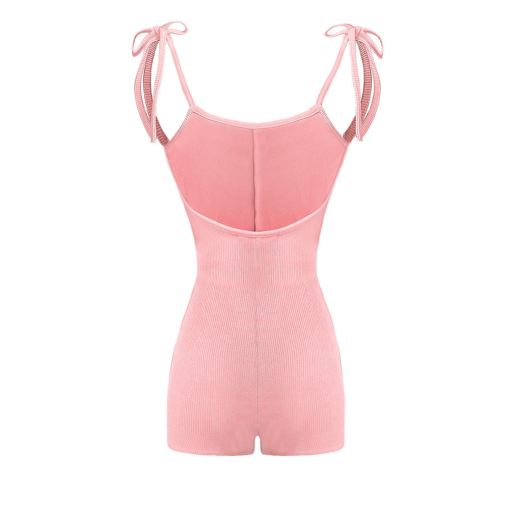 Pink romper with thin straps on a white background