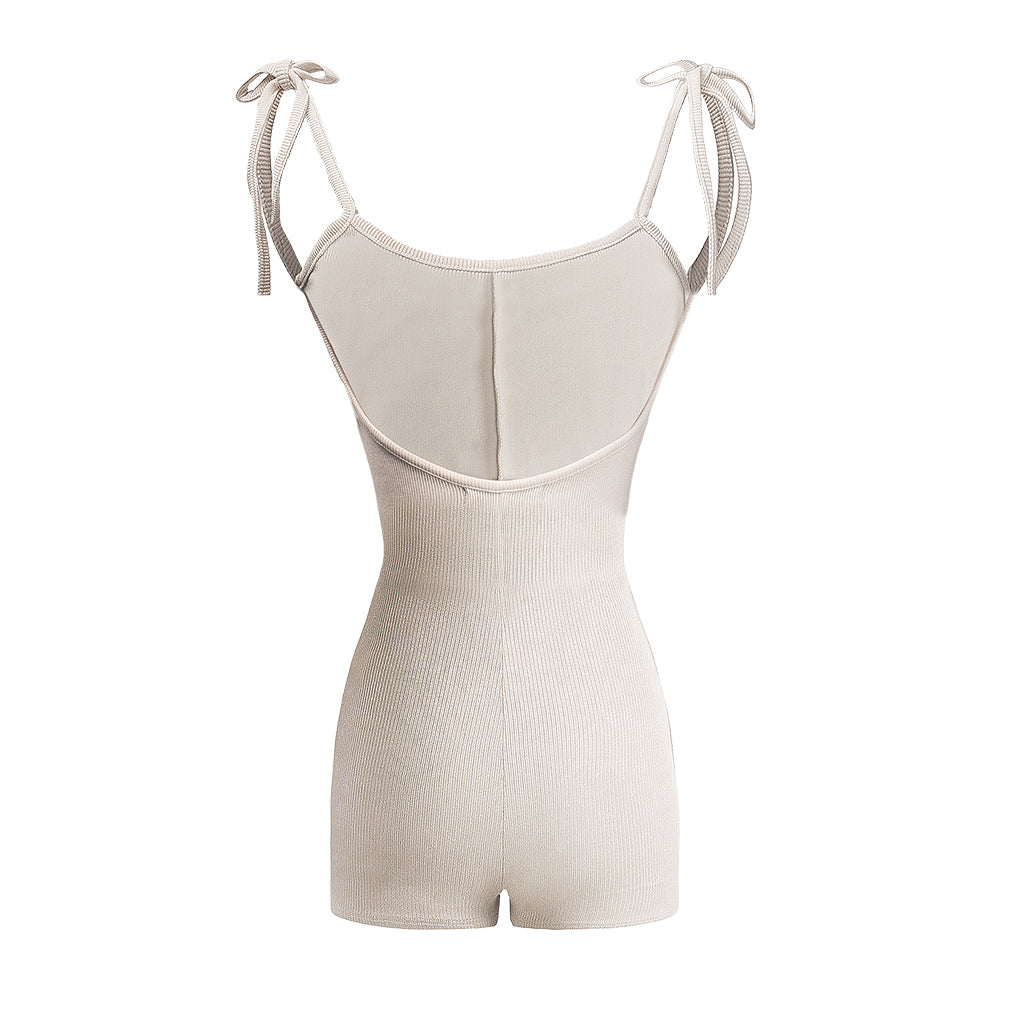 Beige ribbed romper with thin straps on a white background