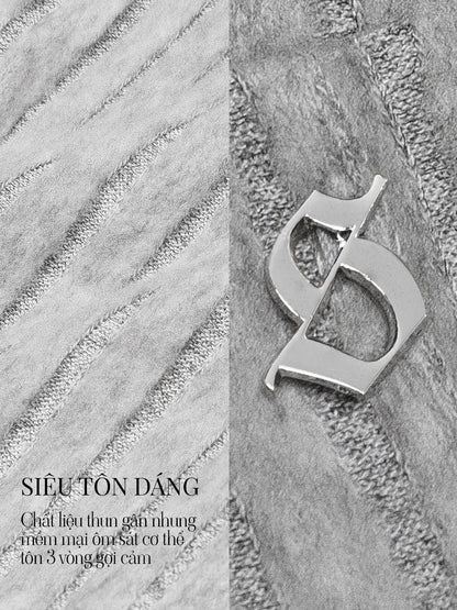 Silver ring with a unique design on a textured stone background