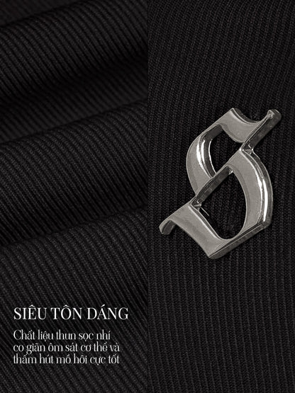 Close-up of a silver logo on black textured fabric with text overlay.