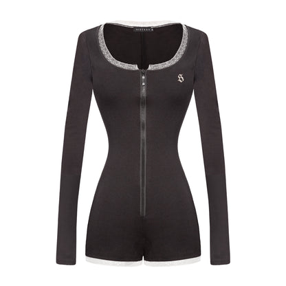 Black long-sleeve romper with silver trim on a white background