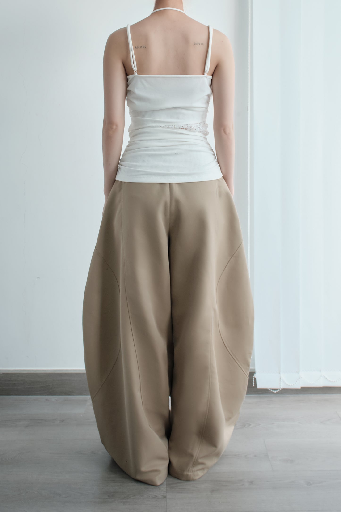 Side view of Luft Pants – soft drape and full-length fit