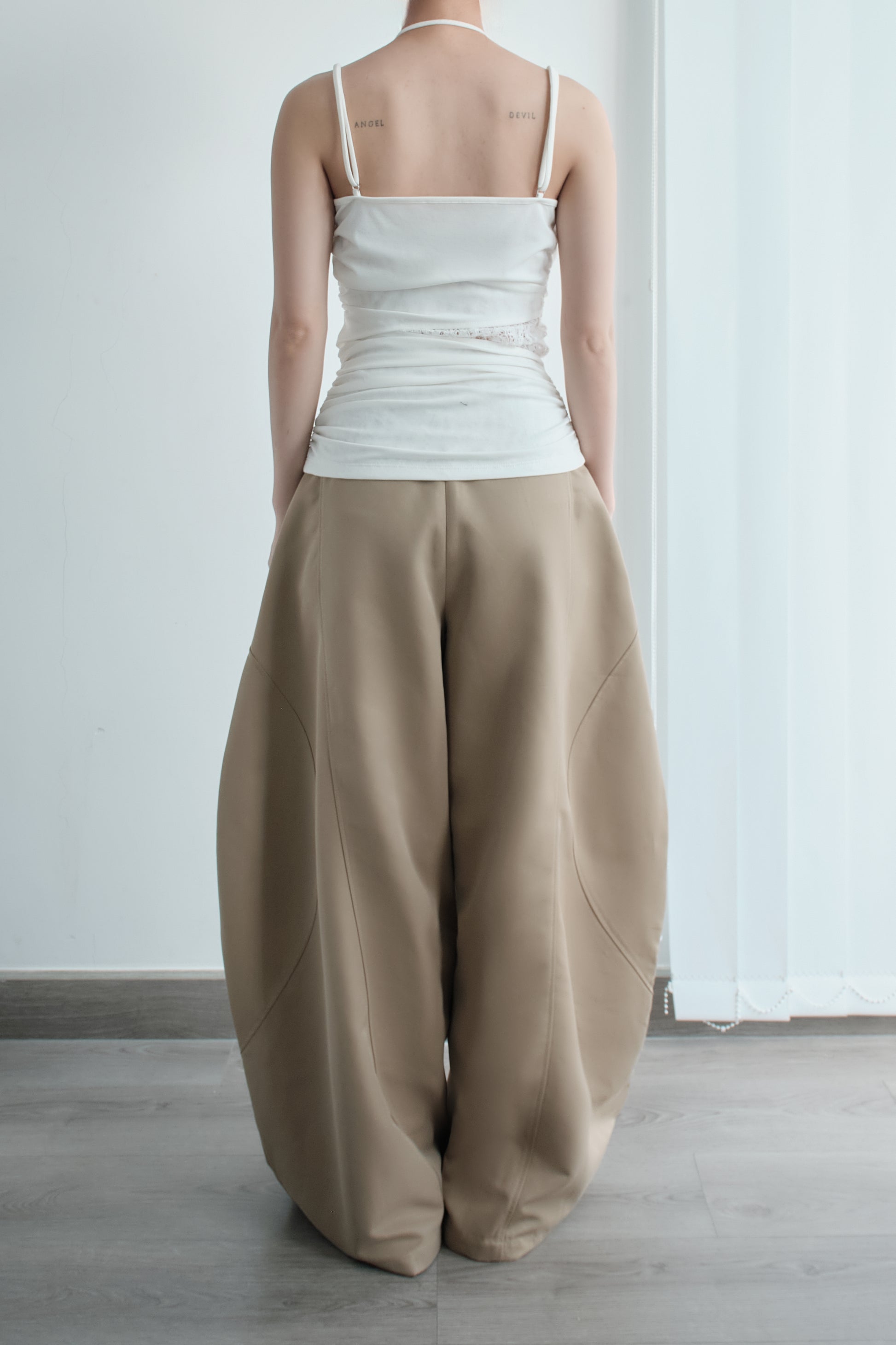 Side view of Luft Pants – soft drape and full-length fit