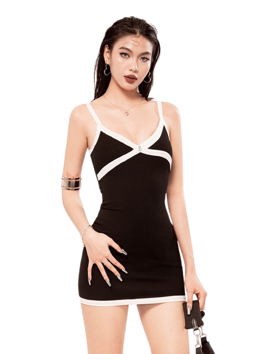 Woman wearing a black and white dress on a white background