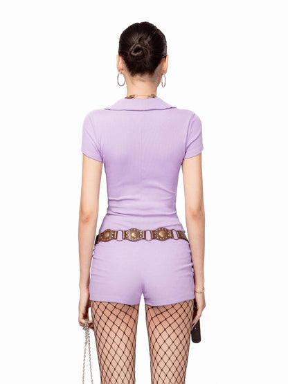 Person wearing a purple outfit with a belt and fishnet stockings on a white background