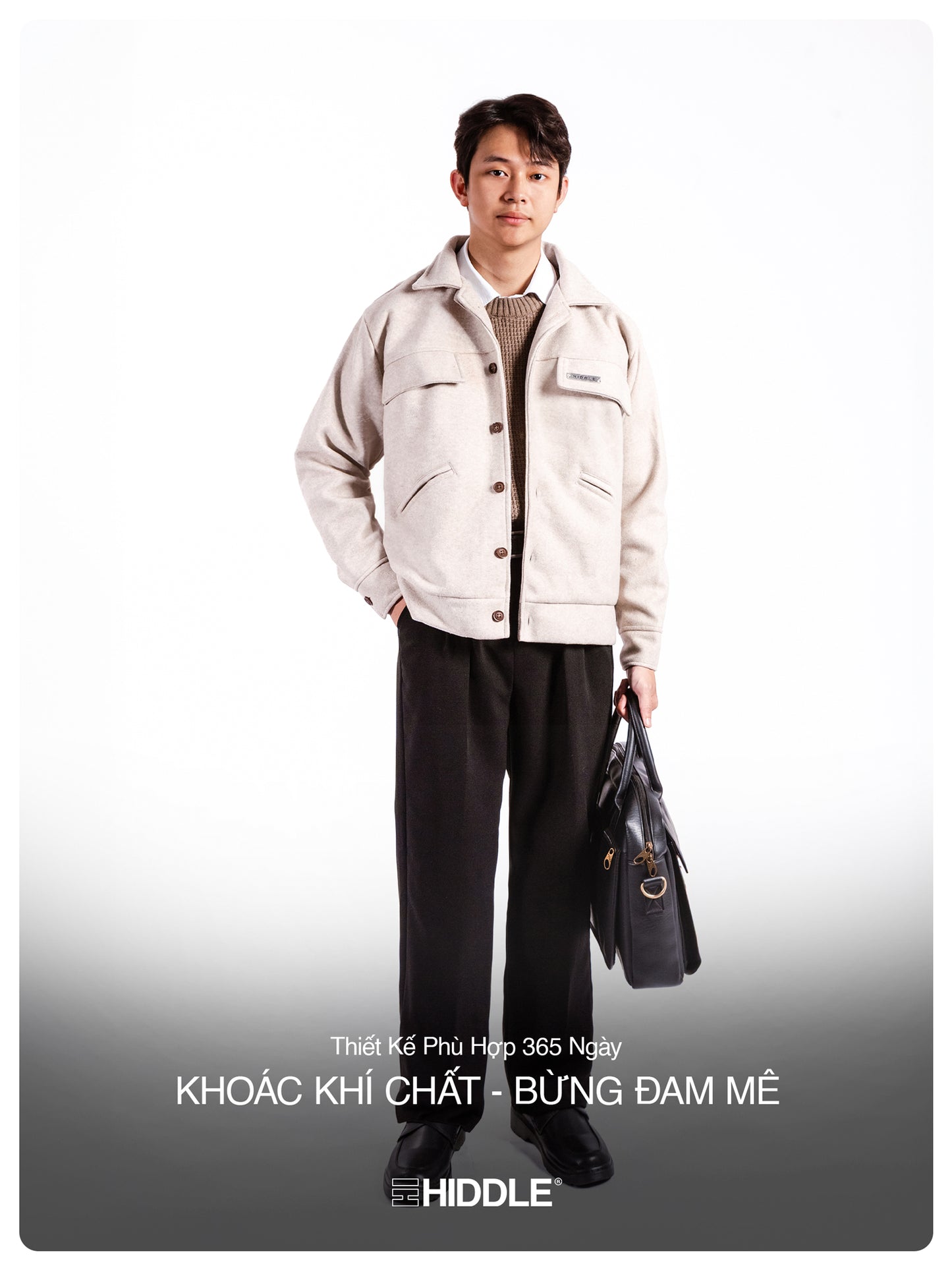 Man wearing a white jacket and black pants holding a bag on a white background with text.