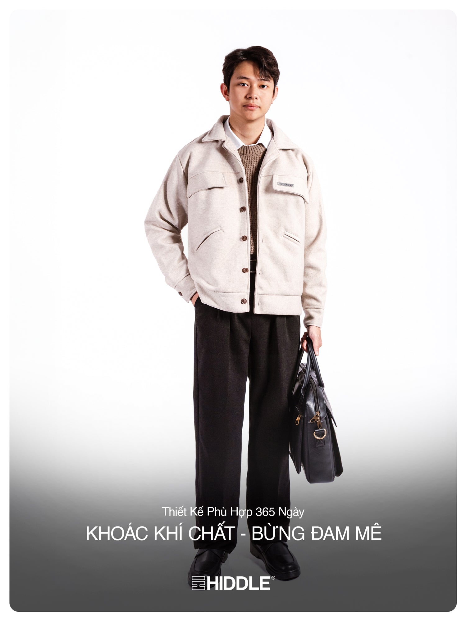 Man wearing a white jacket and black pants holding a bag on a white background with text.