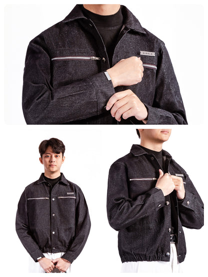 Dark denim jacket with zippers and buttons worn by a person on a white background