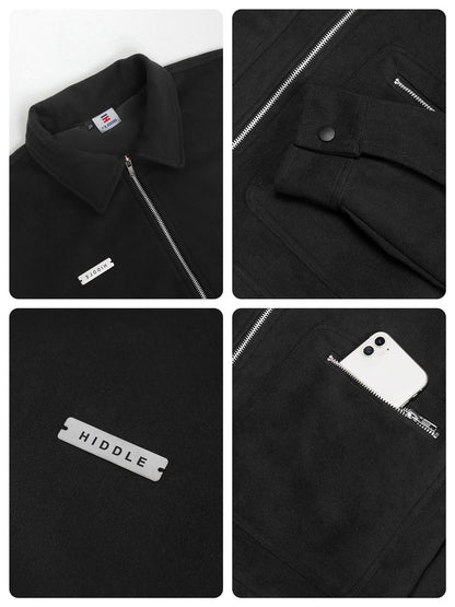 Black jacket with visible branding and features on a white background