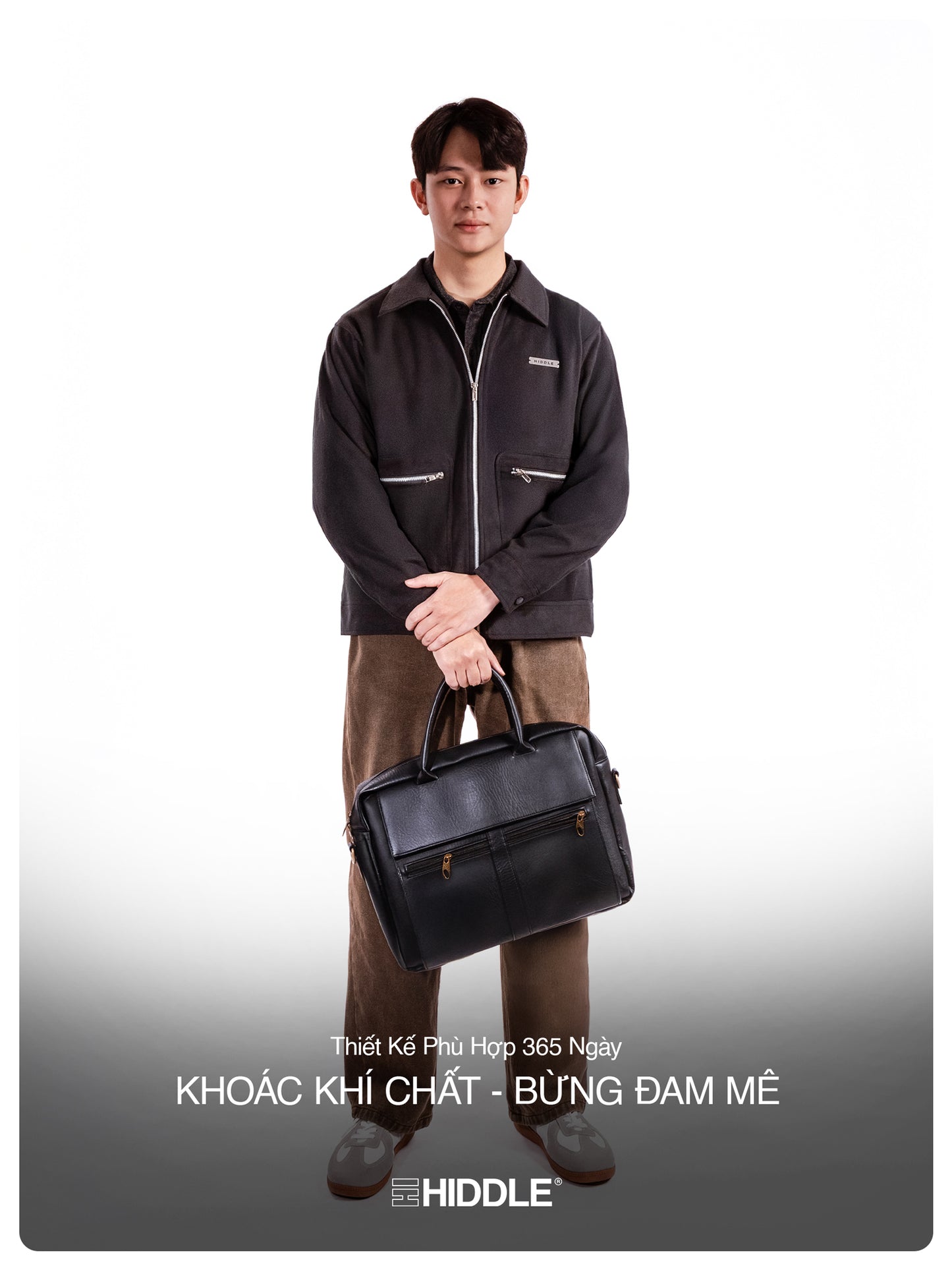 Man holding a black briefcase against a white background with Hiddle branding.