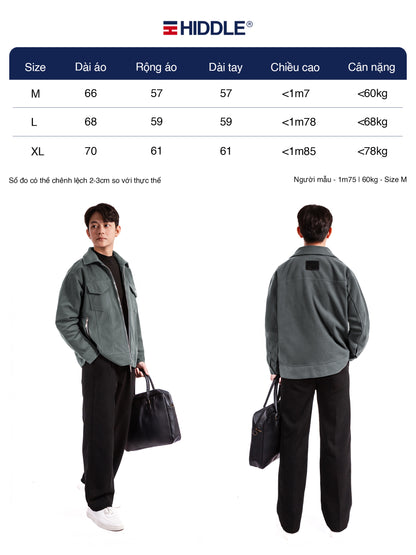 Person wearing a gray jacket with size chart and Hiddle branding