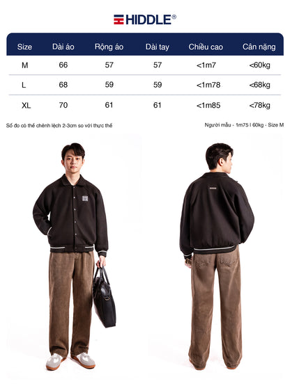 Person wearing a black jacket and brown pants with Hiddle branding, showing front and back views.