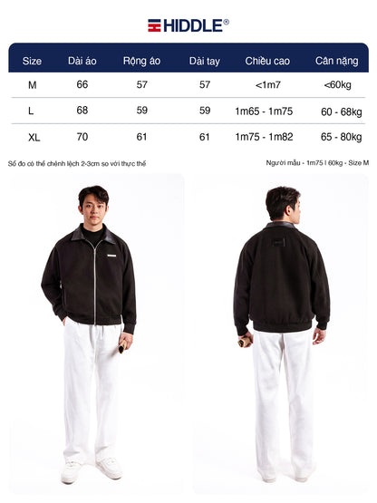 Person wearing a black jacket with size chart and Hiddle logo