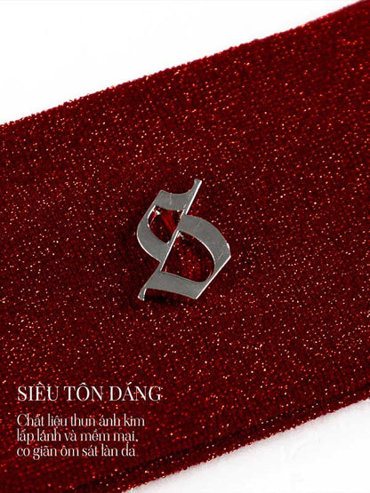Red glittery fabric with a silver logo on a white background