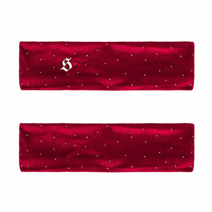 Two red satin headbands with small white embellishments on a white background