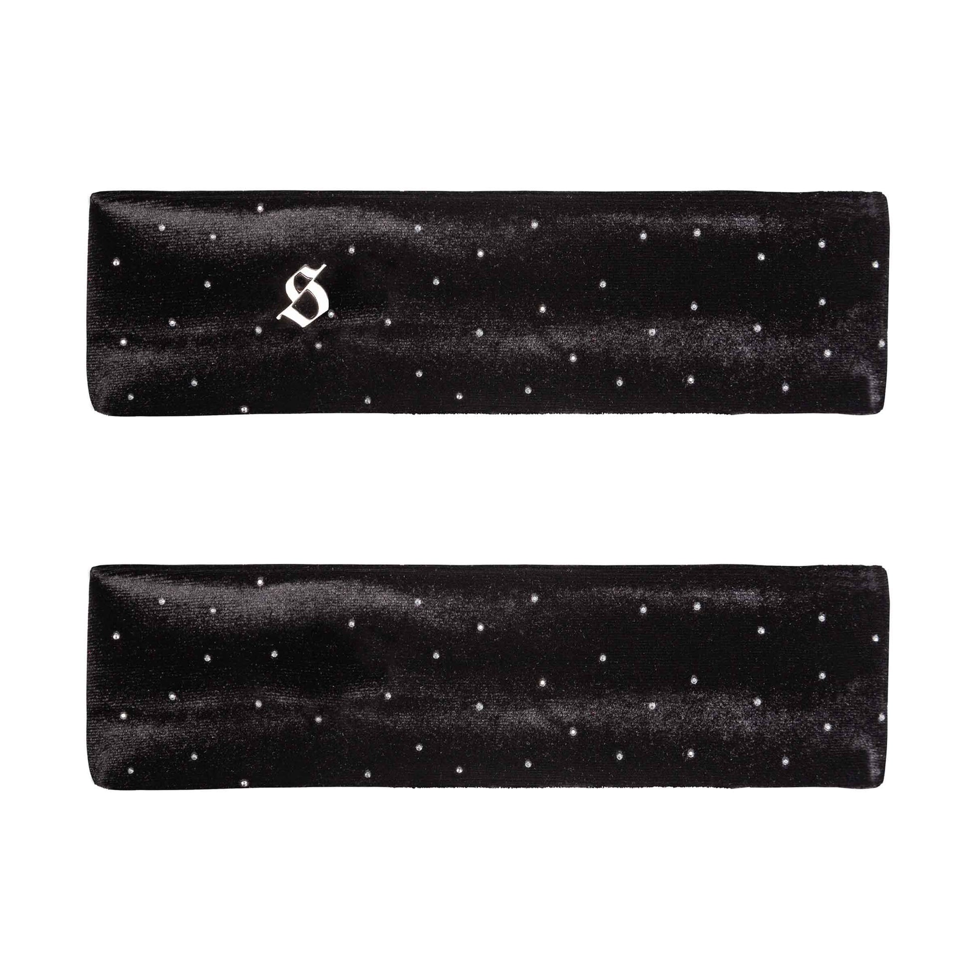 Two black satin headbands with white polka dots on a white background