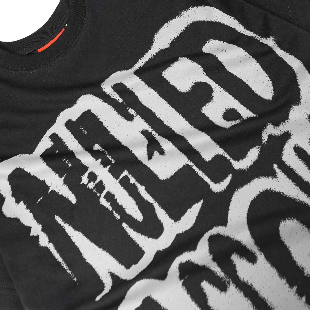 Black t-shirt with white graphic design on a white background
