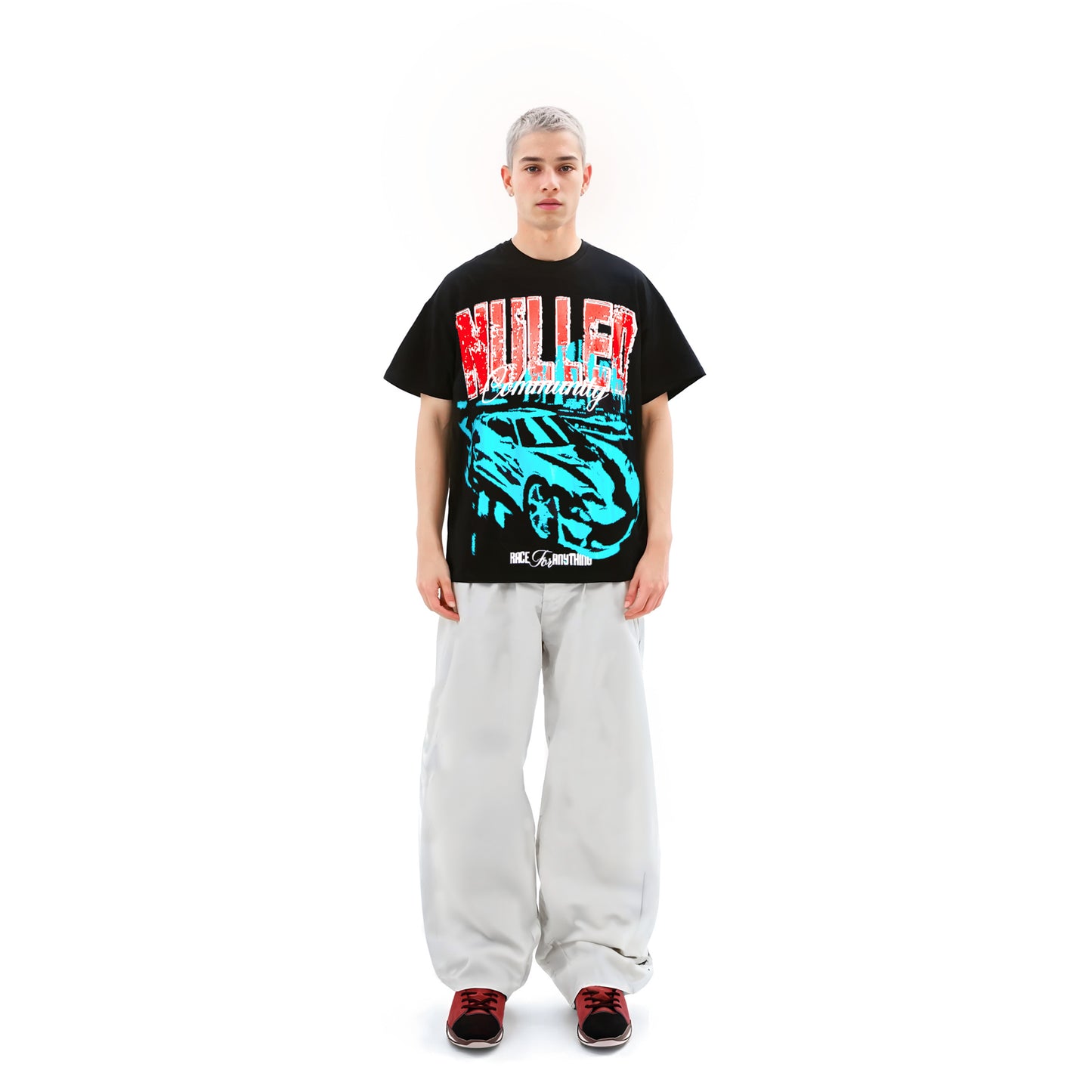 Person wearing a black t-shirt with colorful graphics and text on a white background
