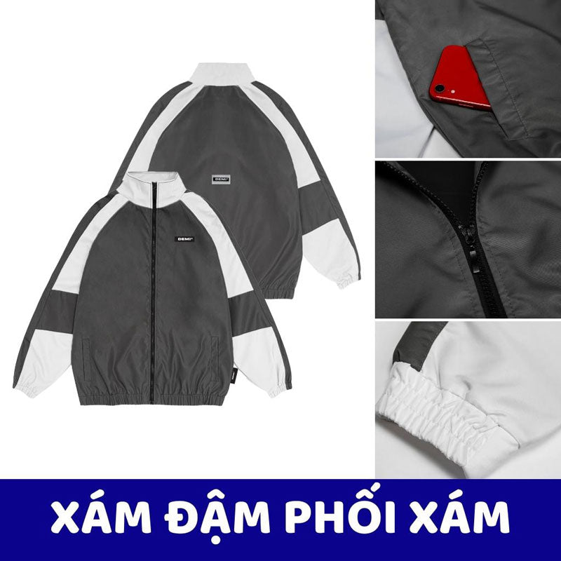 Gray and white jacket with red phone pocket, close-up details on a white background.