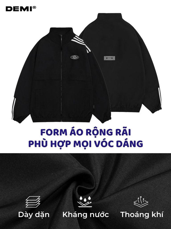 Black jacket with white stripes on sleeves and back, featuring DEMI brand logo.