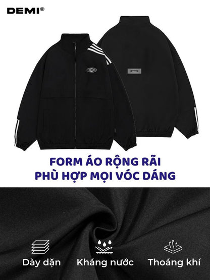 Black jacket with white stripes on sleeves and back, featuring DEMI brand logo.