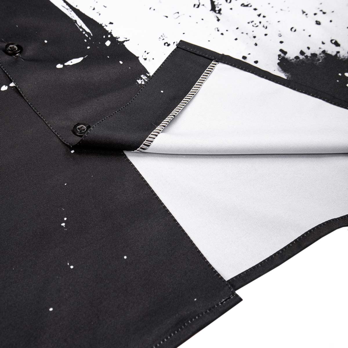 Black shirt with white paint splashes on a white background