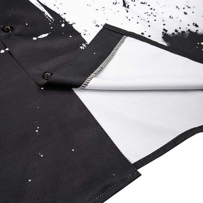Black shirt with white paint splashes on a white background