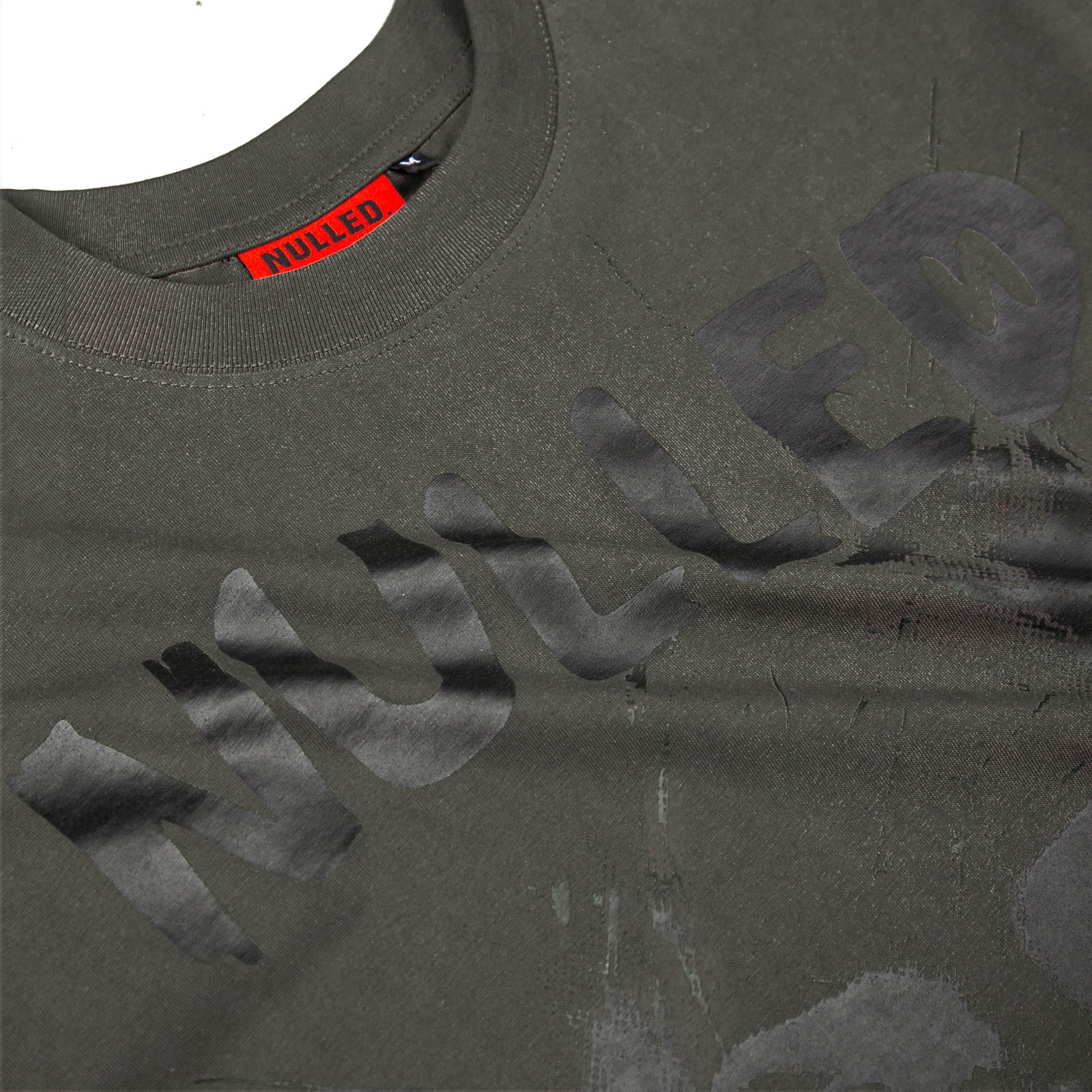 Dark gray t-shirt with 'Hollister' branding and a red tag on a white background