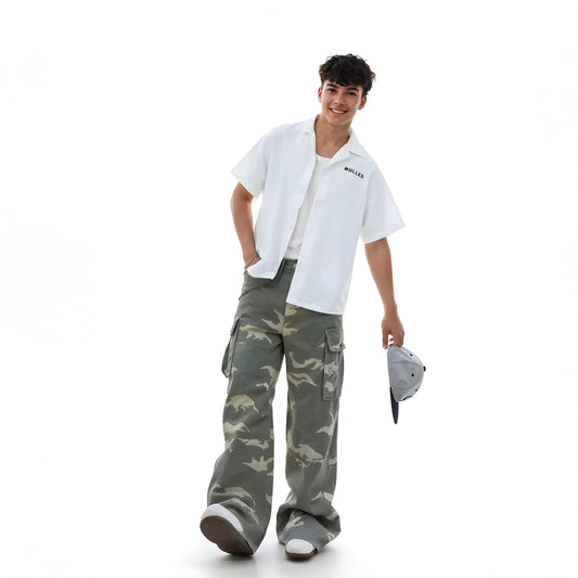 Person wearing a white shirt and camouflage pants on a white background