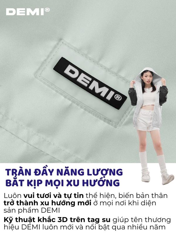 Person wearing a white outfit with a DEMI logo on a light gray background