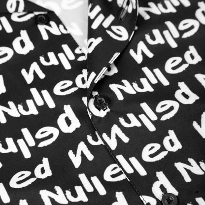 Black shirt with white text pattern on a mannequin