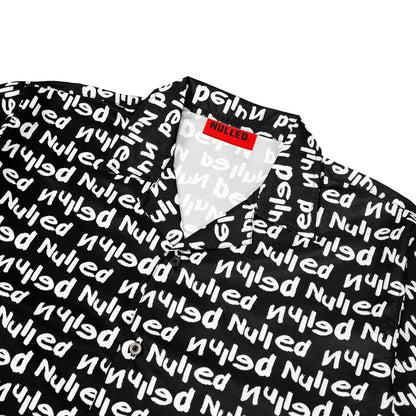 Black shirt with white text pattern and a red label on a white background