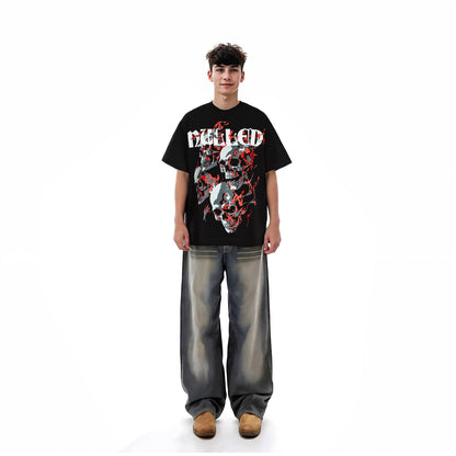 Person wearing a black graphic t-shirt with a design on a white background