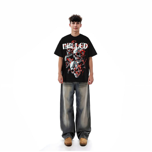 Person wearing a black graphic t-shirt with a design on a white background