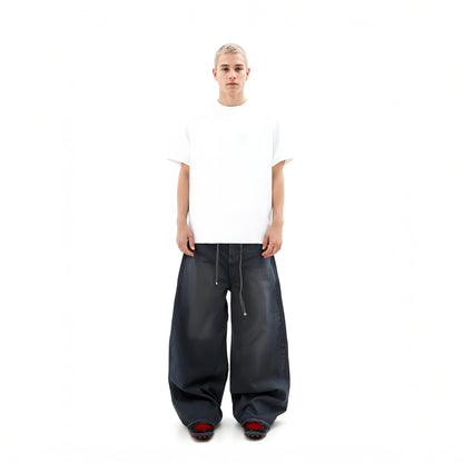 Person wearing a white t-shirt and black wide-leg pants on a white background