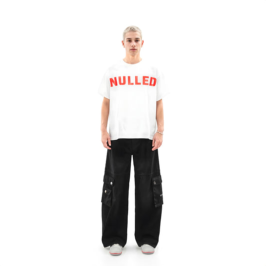 Person wearing a white t-shirt with 'NULLED' printed in red on a white background