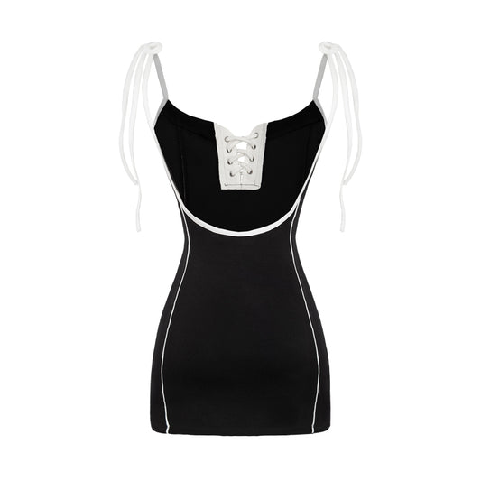 Black dress with white accents on a white background