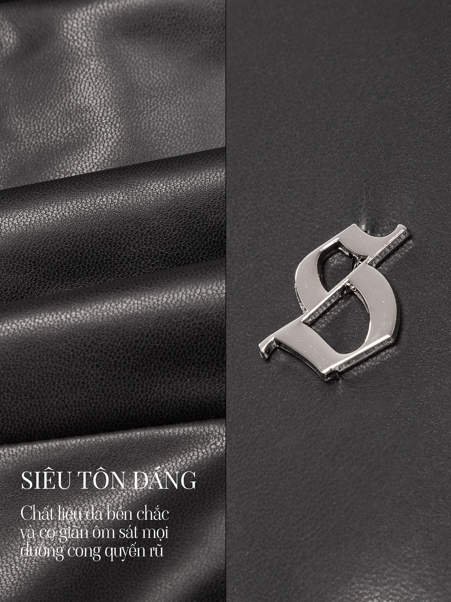 Metallic logo on black leather surface with text in Vietnamese