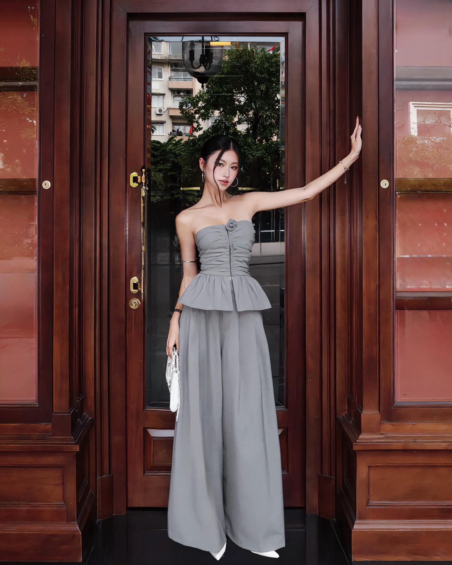 Model walking in Ruby Bebe Pants outdoors