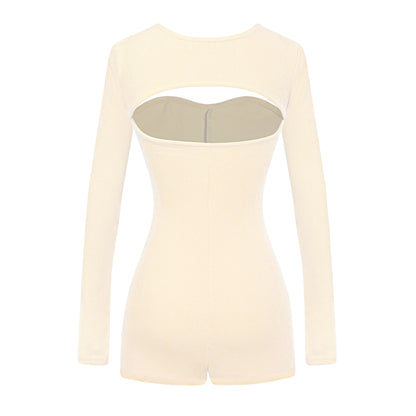 Beige long-sleeve top with cut-out design on a white background