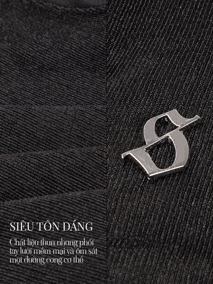 Close-up of a black fabric texture with a silver logo and text overlay.